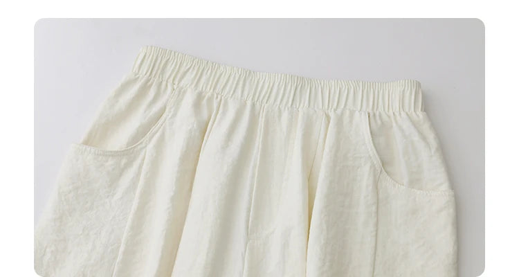 High-Waist White Pleated Pants – 2025 Collection
