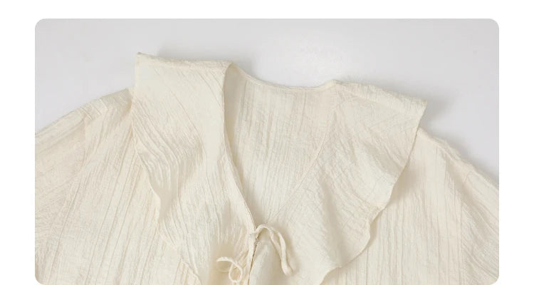 Ruffled V-Neck Lace-Up Blouse – Spring 2025 Collection