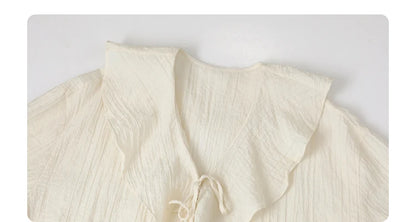 Ruffled V-Neck Lace-Up Blouse – Spring 2025 Collection